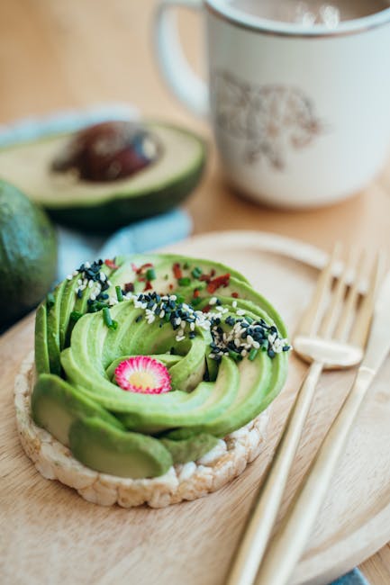 A vibrant avocado toast garnished with radish and seeds, served with tea.